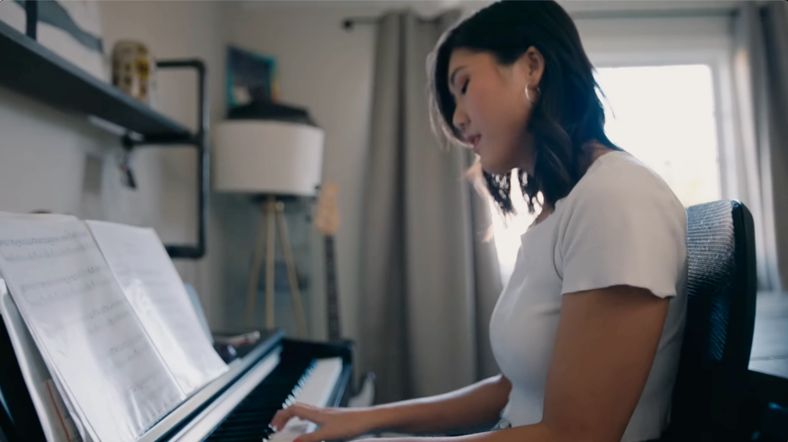 Woman playing piano at home